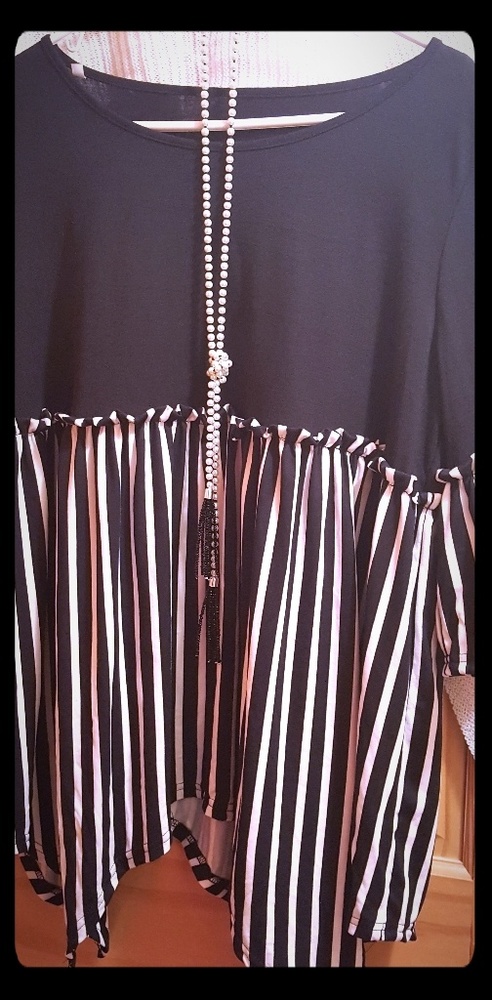 Black and white asymmetrical blouse.
